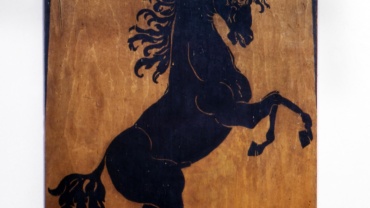 The wooden panel with the Prancing Horse, now exhibited in our Museum